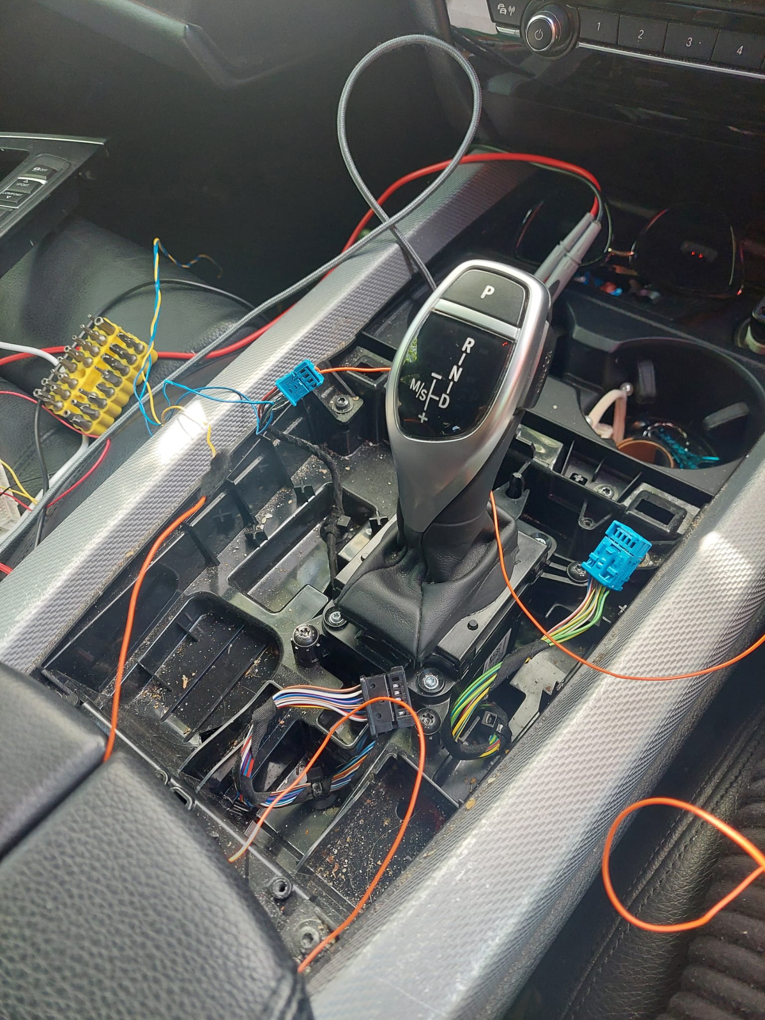 Hidden aftermarket vehicle immobiliser installed in a car's wiring