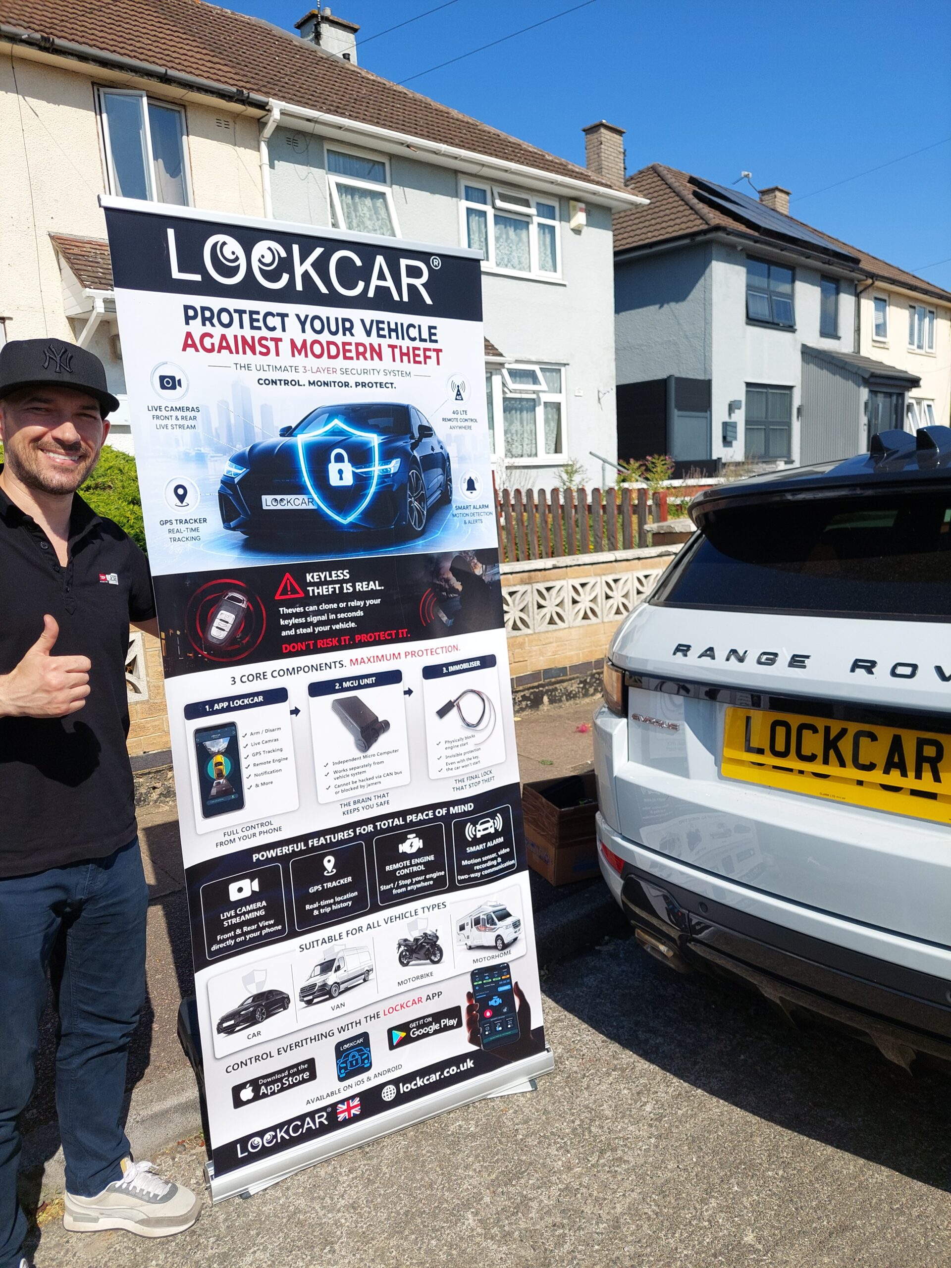 Mobile vehicle security engineer working on a car parked on a residential driveway