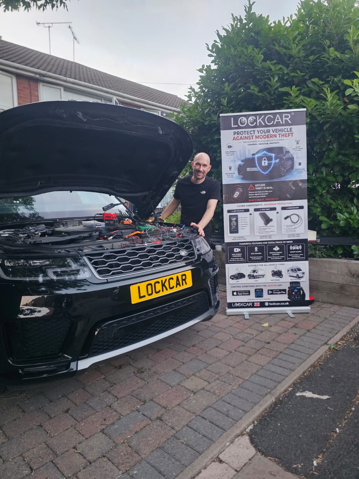 Immobiliser installation being carried out on a customer vehicle at their home