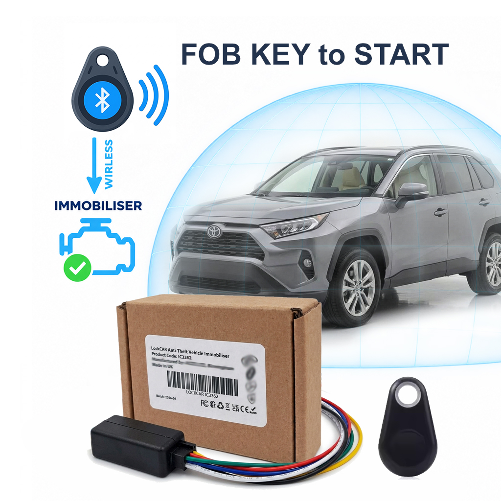 Small key fob immobiliser tag attached to a car keyring next to the engine start button