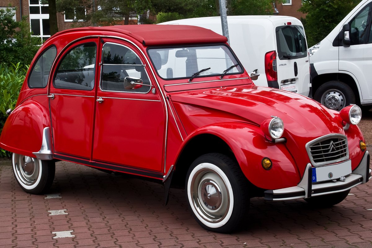 Red classic Citroën 2CV6 Club, front three-quarter view