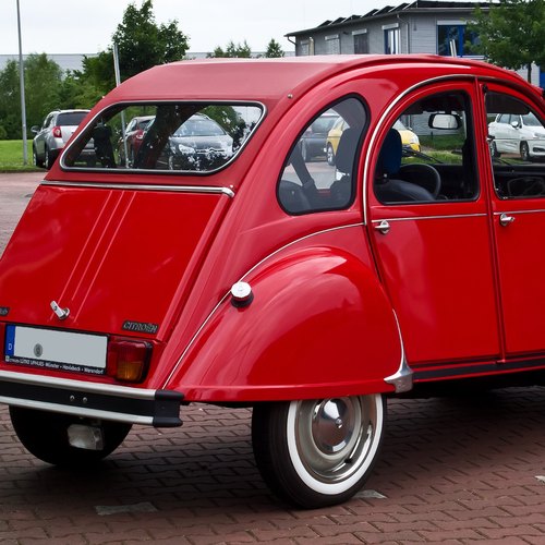 Rear three-quarter view of a red Citroën 2CV6 Club